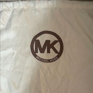 Michael Kors cream dust bag with brown MK logo